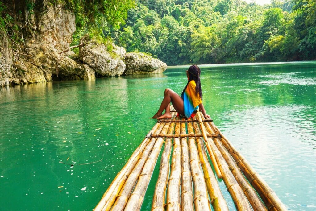 Woman on a bamboo raft in port antonio Jamaica