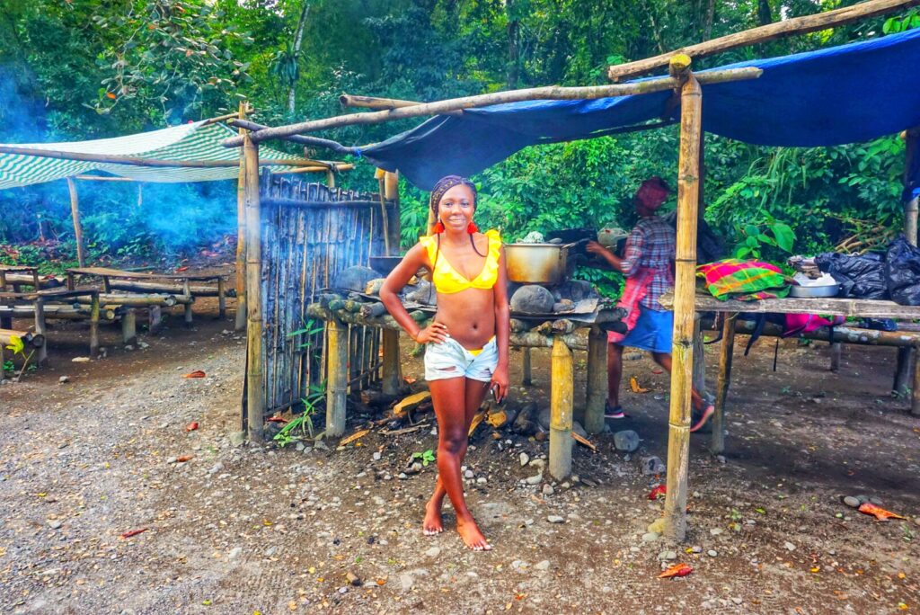 Woman standing outside a riverside restaurant in Port Antonio Jamaica