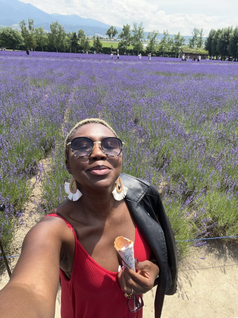 Black Woman in Red Dress at Tomita Farm Hokkaido
