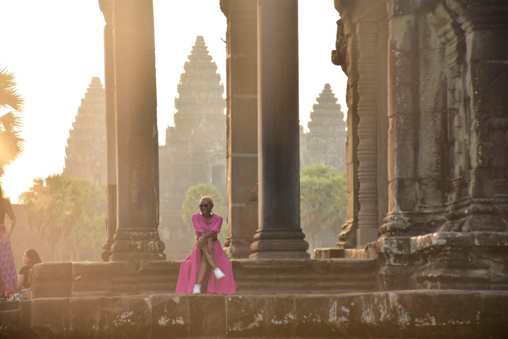 Black Woman in pink Dress at Angkor Wat Cambodia
