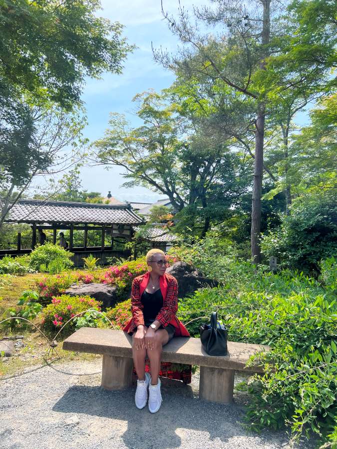 Dee in Kyoto Japan relaxing in a garden