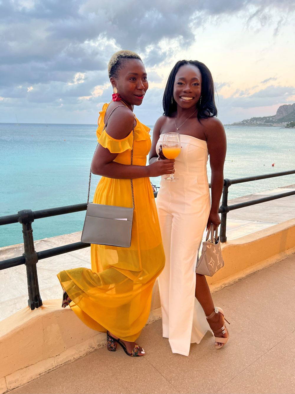 The bride and her friend at a pre-wedding event at a destination wedding in Sicily