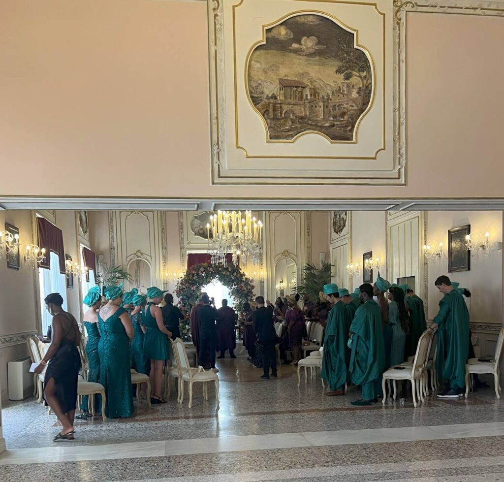A well-planned wedding has the guest in traditional Yoruba dresses for a destination wedding at Sicily