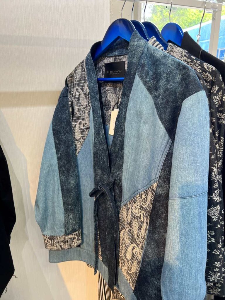 Rack of high-quality Japanese denim jackets, a popular souvenir from Japan’s fashion scene.