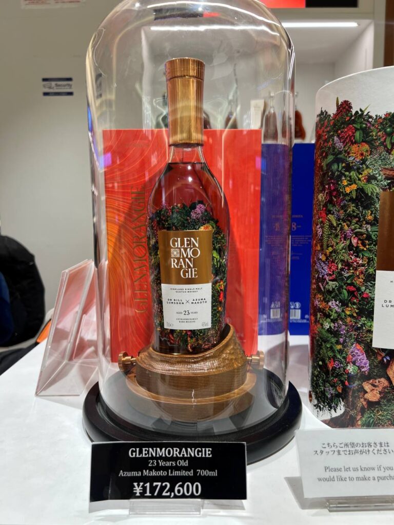 Shelf of Japanese whiskies featuring Yamazaki 12, a top souvenir from Japan.