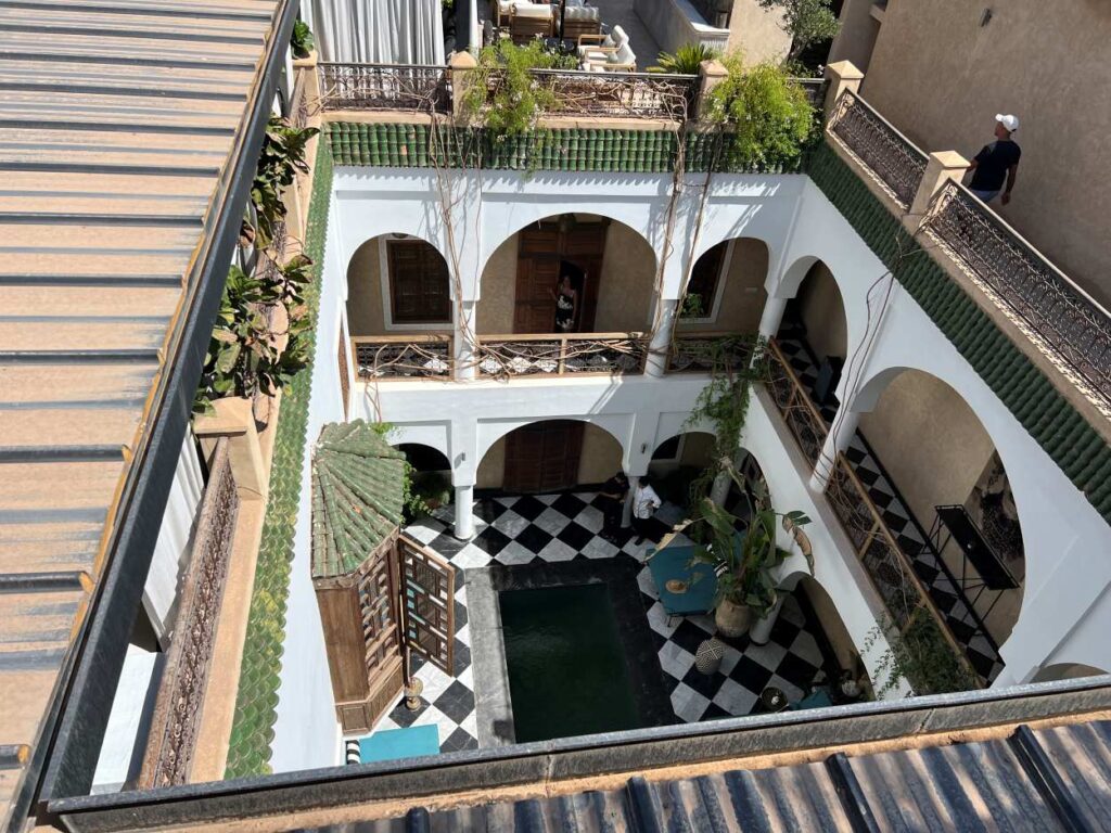 The stunning pool, lovely courtyard, and rooftop terrace of Riad Sakkan, a luxury stay in Marrakech