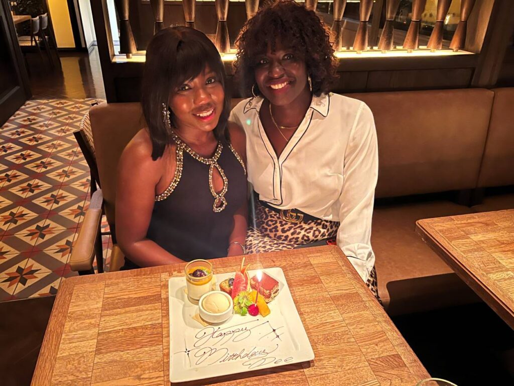 Dee, a Nigerian-American travel blogger celebrating her birthday with her friend in Tokyo.
