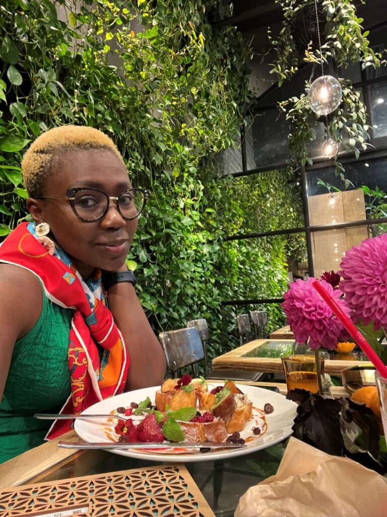 Dee enjoying the signature flower-crown French toast at Tea House Akasaka.