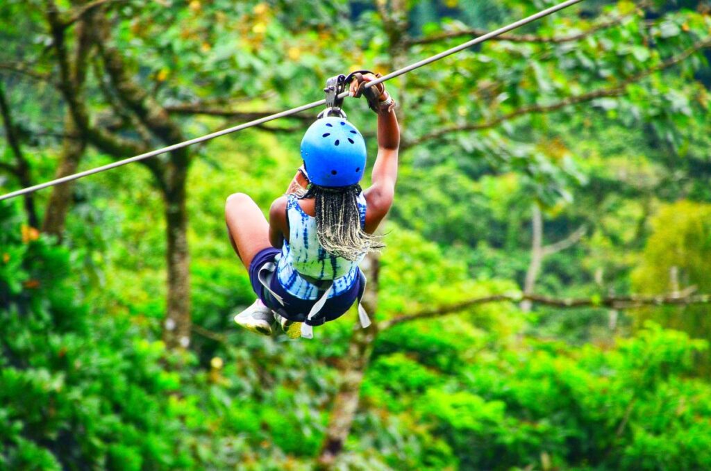 Zip-lining through Costa Rica’s cloud forest, showcasing thrilling 40th birthday travel ideas