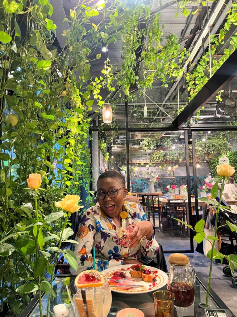 Dee enjoying a meal of flower-crown French toast, French tea and grapefruit juice at Aoyama Flower Market 