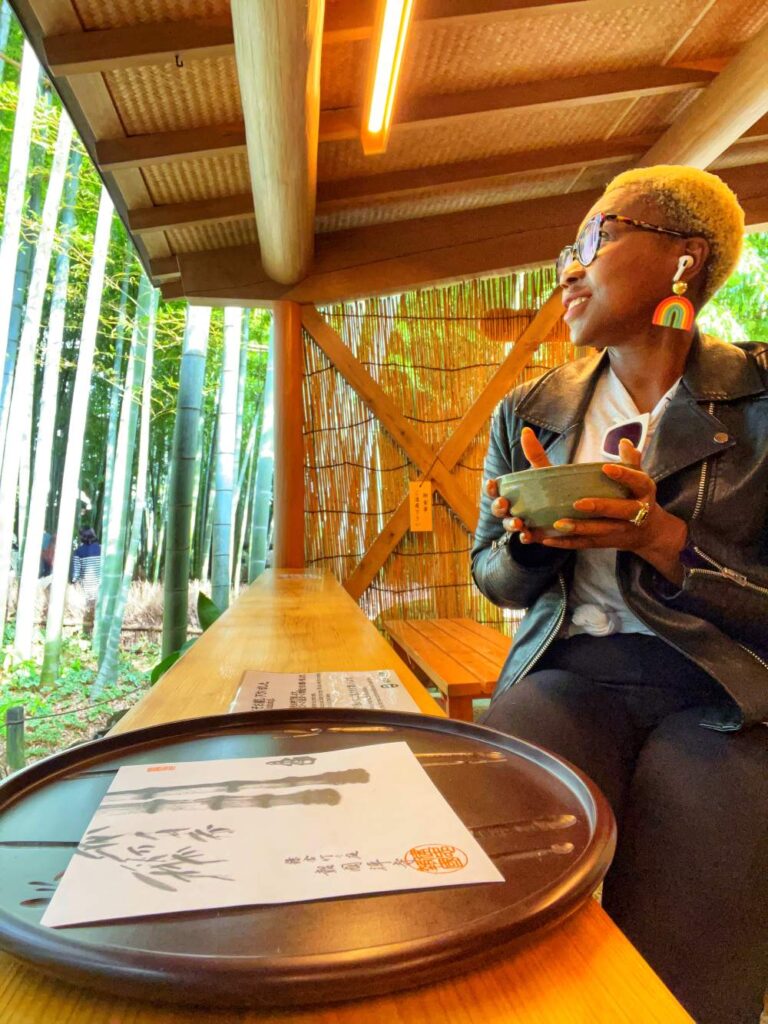 Woman enjoying matcha tea in Japan, highlighting mindful culinary 40th birthday trip ideas