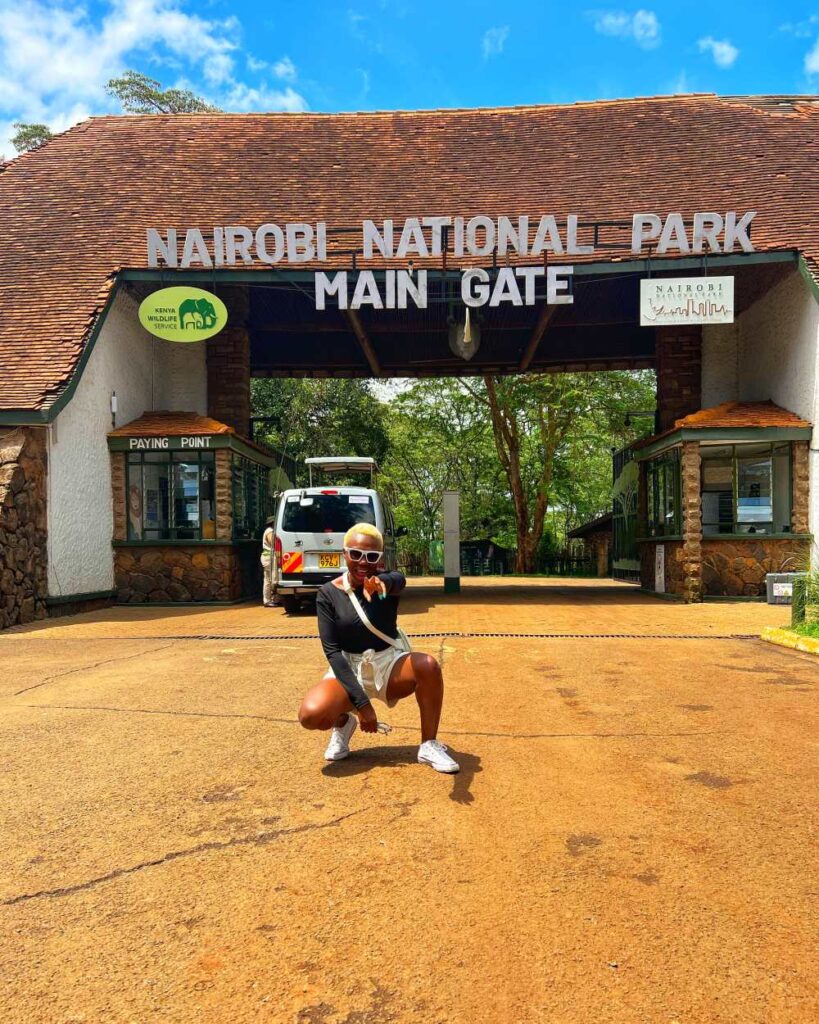 A woman exploring Nairobi National Park, showcasing unique urban-meets-wildlife 40th birthday trip ideas
