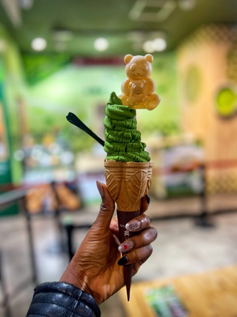Matcha ice cream enjoyed on a Kyoto street, representing sweet and cultural 40th birthday travel ideas