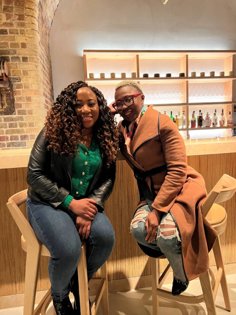 A travel blogger celebrates meeting her friend in London o a work trip, among several other international travels.