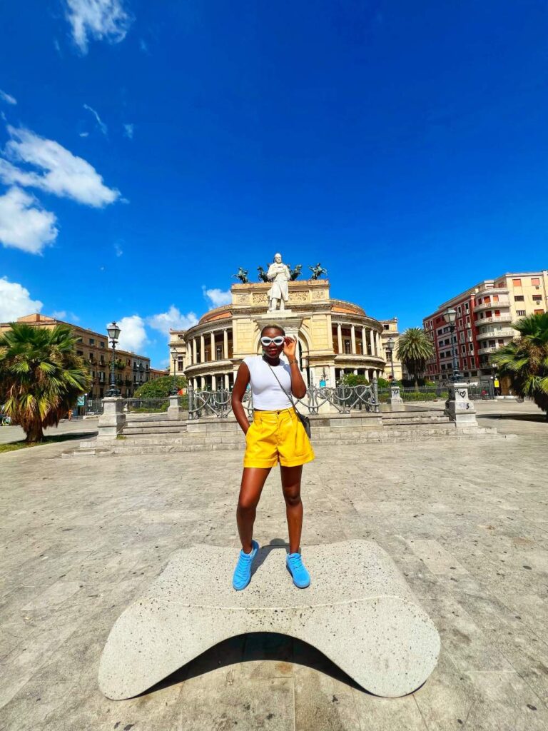 A woman exploring Sicily, Italy, capturing why meaningful travel experiences are among the best 40th birthday trip ideas