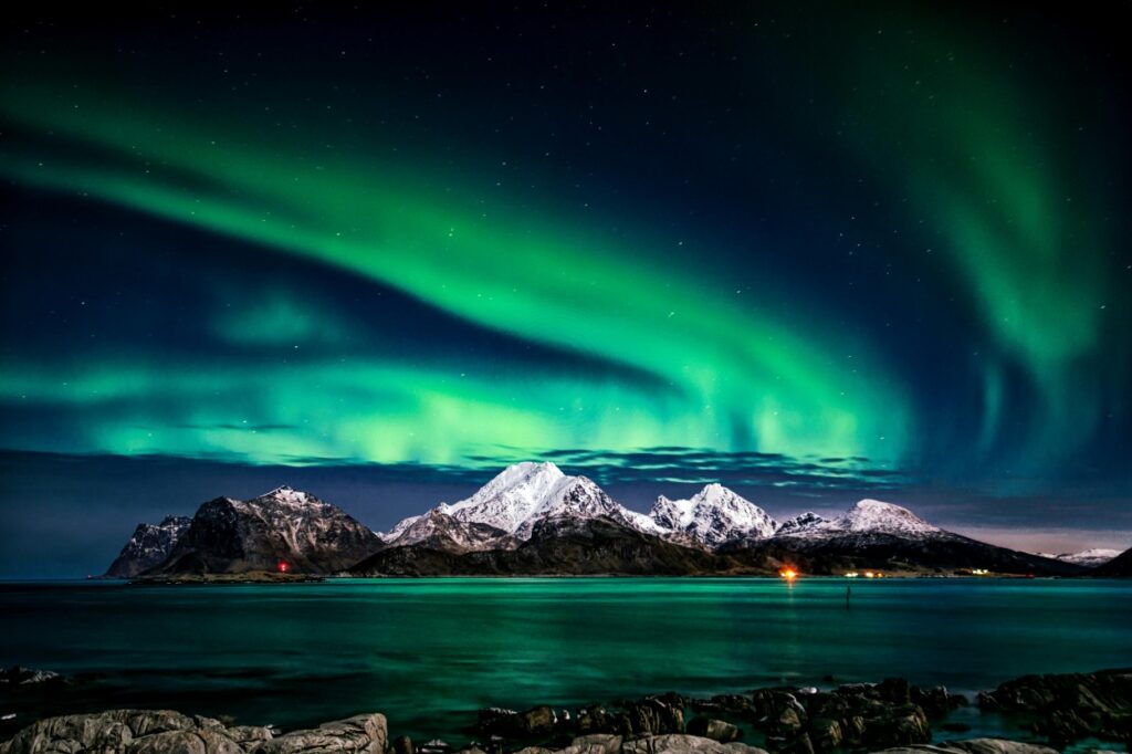 Aurora borealis dancing over Iceland or Norway, symbolizing magical best 40th birthday getaway ideas