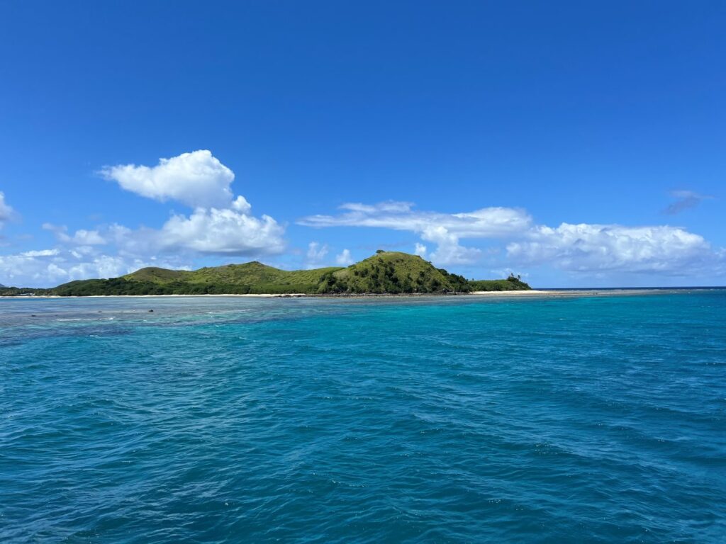 A stunning view of the sea and an island in Fiji spotted on a boat ride.
