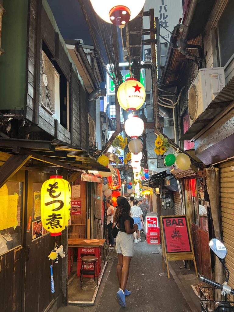Golden Gai has narrow alleys with tiny bars and taverns, offering unique experience for drinks in Tokyo.