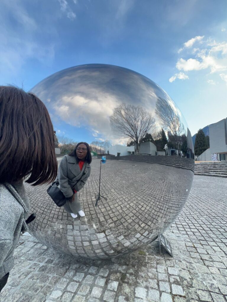 A tourist interacting with the exhibits at Hakone Open Air Museum